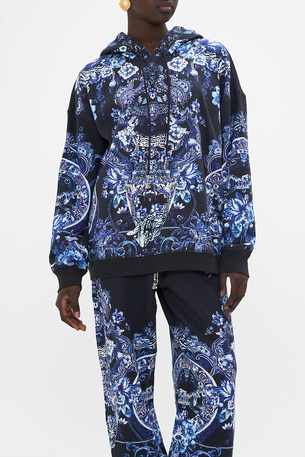 Crop view of model wearing CAMILLA printed hoodie in Delft Dynasty print