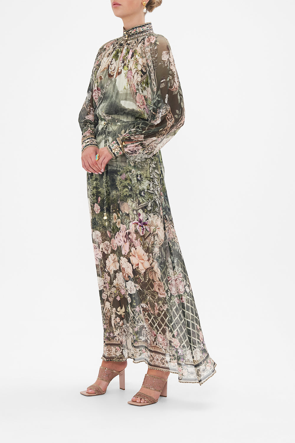 Side view of model wearing CAMILLA green silk floral maxi dress in Garden Of Good Fortune print
