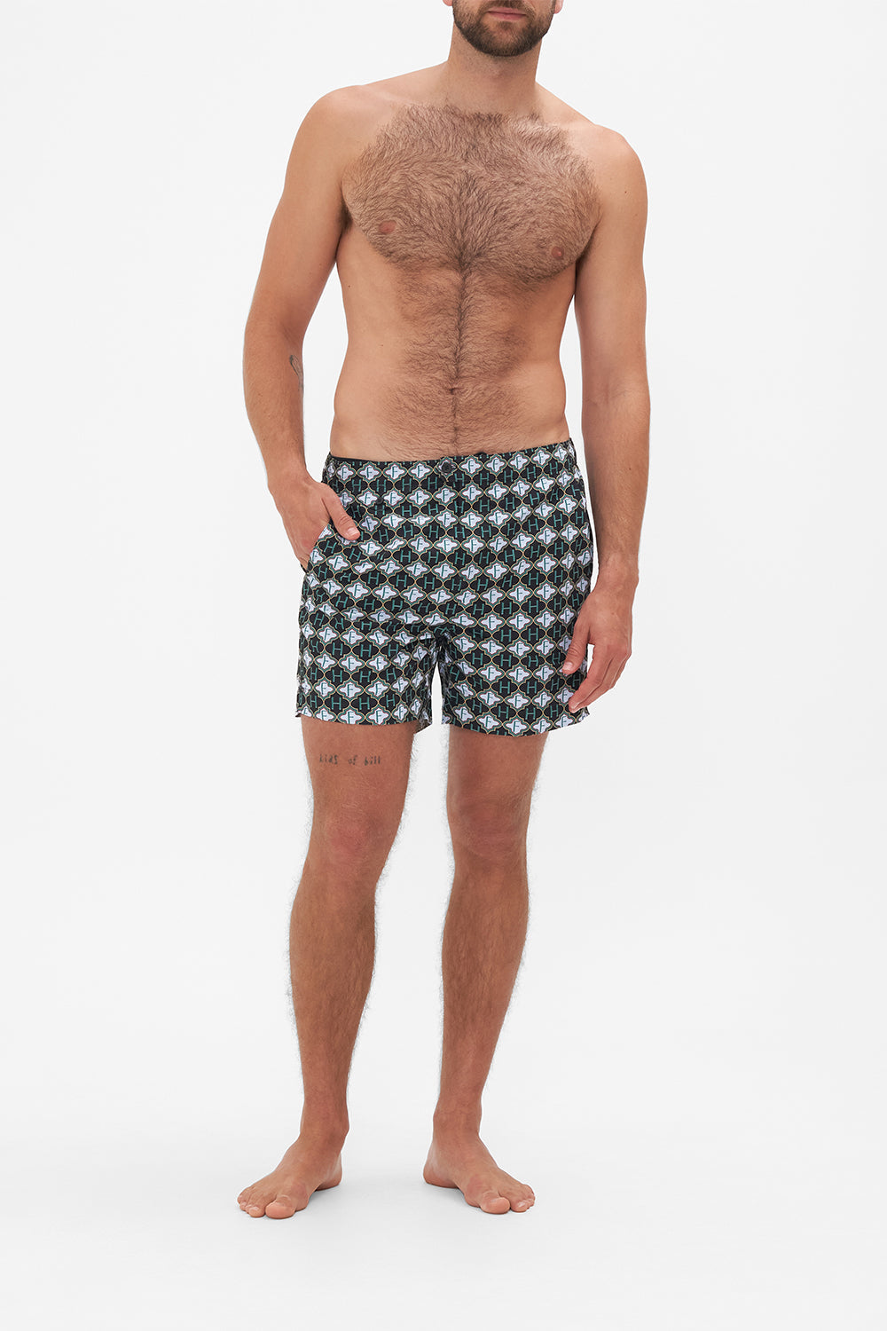 Front view of model wearing Hotel Franks by CAMILLA mens monogram print boardshorts in Jealousy And Jewels print