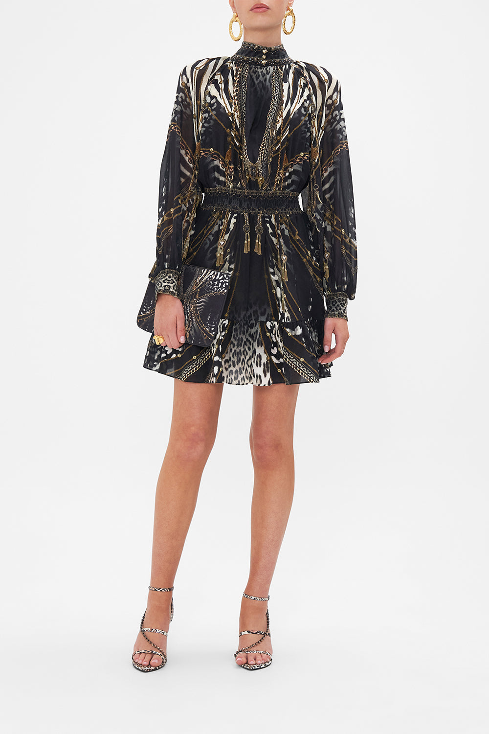 Front view of model wearing CAMILLA black and white animal print mini dress in Untamed Royalty print