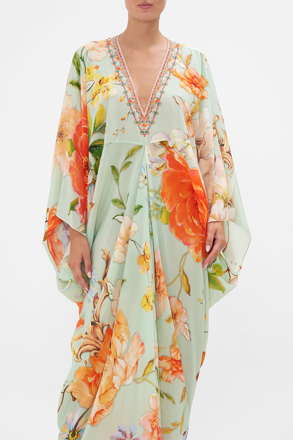 Crop view of model wearing CAMILLA floral silk kaftan in Talk The Walk print