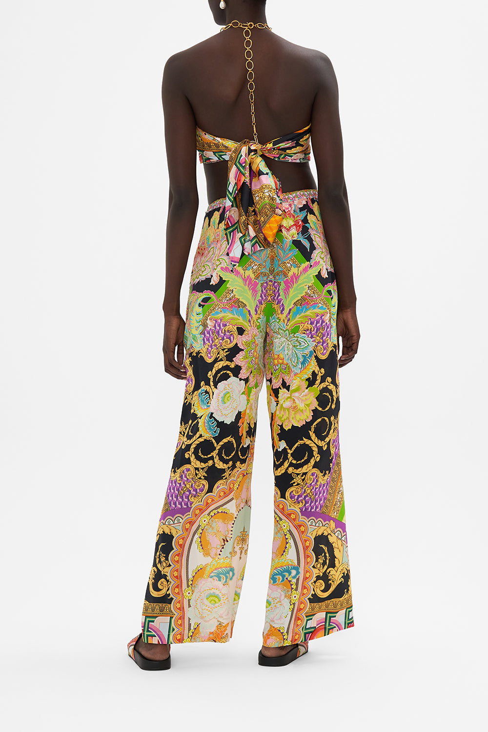 Back view of model wearing CAMILLA silk wide leg pant in Sundowners in Sicily print