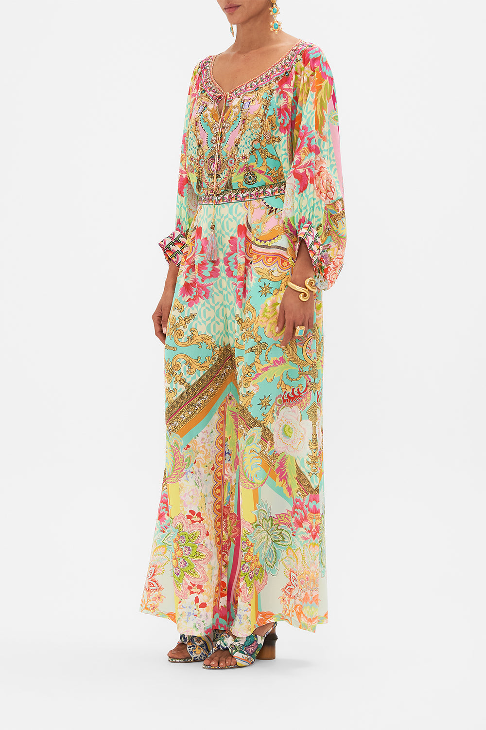 Side view of model wearing CAMILLA silk tuck front pant in An Italian Welcome print