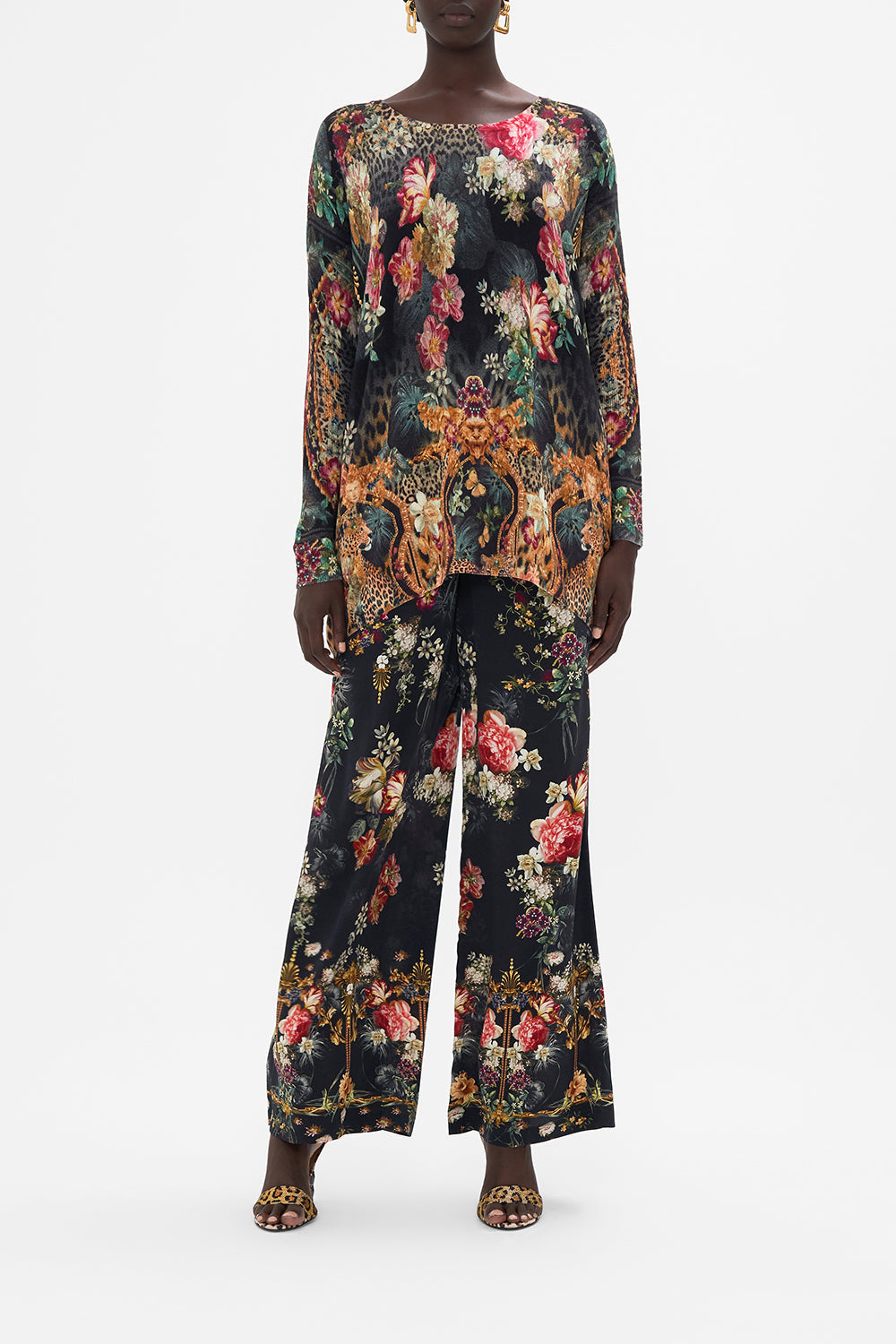 Front view of model wearing CAMILLA long sleeve knit top in A Night At The Opera print