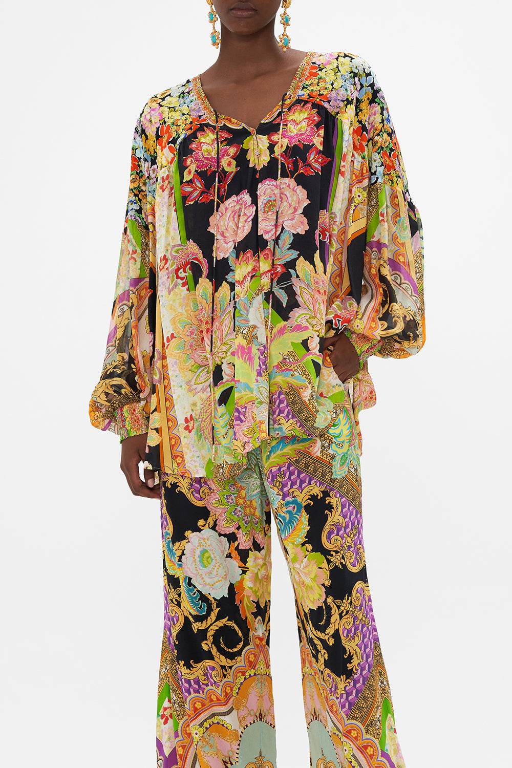 Crop view of model wearing CAMILLA silk blouse in Sundowners in Sicily print