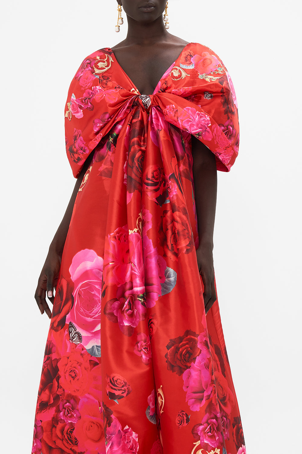 Crop view of model wearing CAMILLA taffeta maxi dress with bow detail in An Italian Rosa print