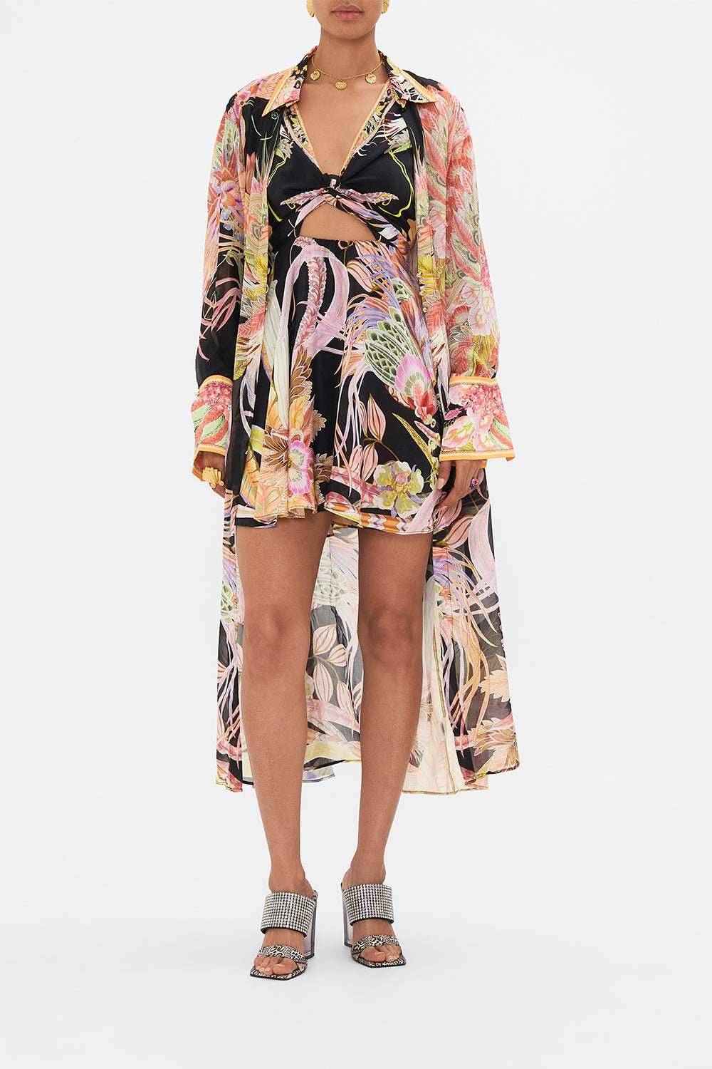 Crop view of model wearing CAMILLA silk kimonop layer in Lady of the Moon print