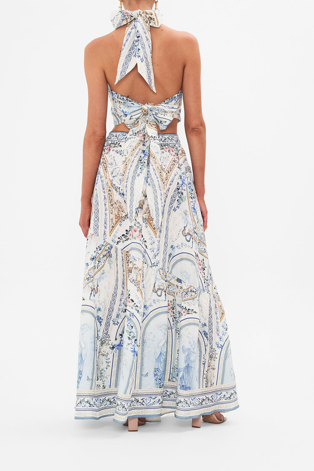 Back view of model wearing CAMILLA designer skirt in Season Of The Siren print