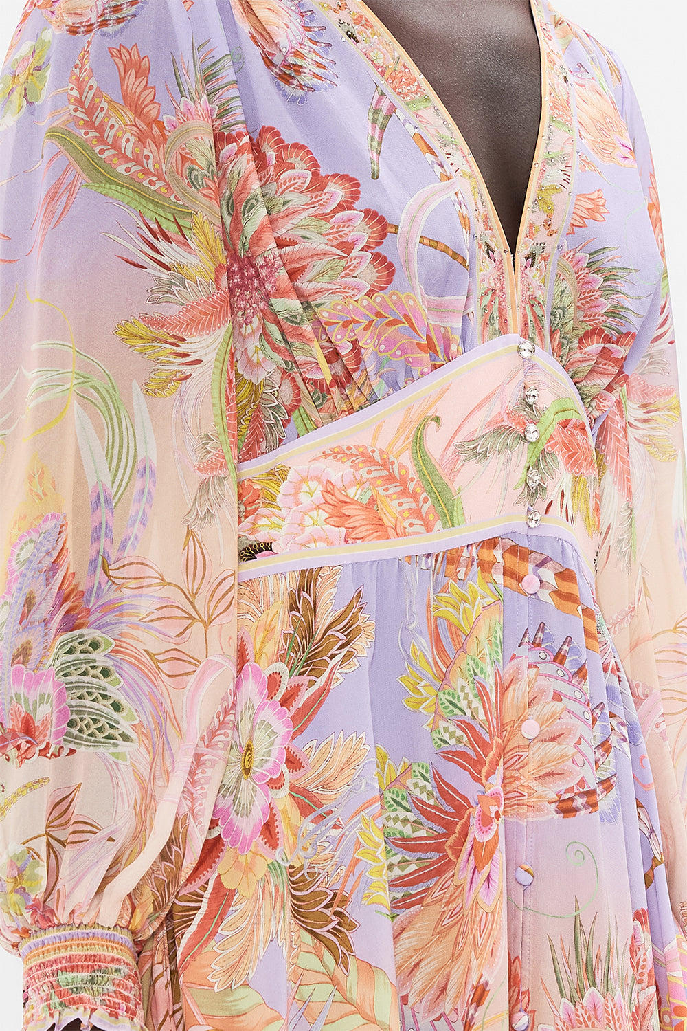 Detail view of model wearing CAMILLA designer silk dress in Cosmic Tuscan print