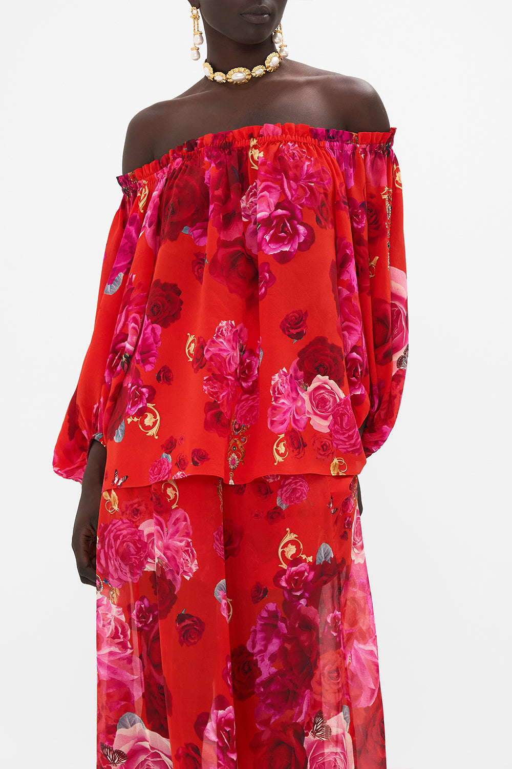 Crop view of model wearing CAMILLA off the shoulder top in An Italian Rosa print