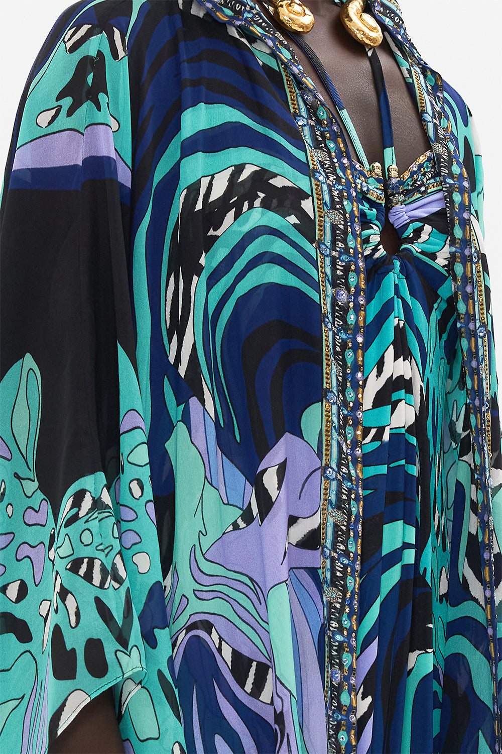 Detail view of model wearing CAMILLA silk robe in Vividly Venice print