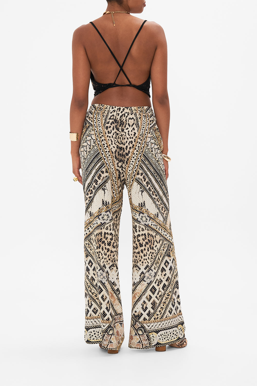 Back view of model wearing CAMILLA silk animal print pants in Mosaic Muse