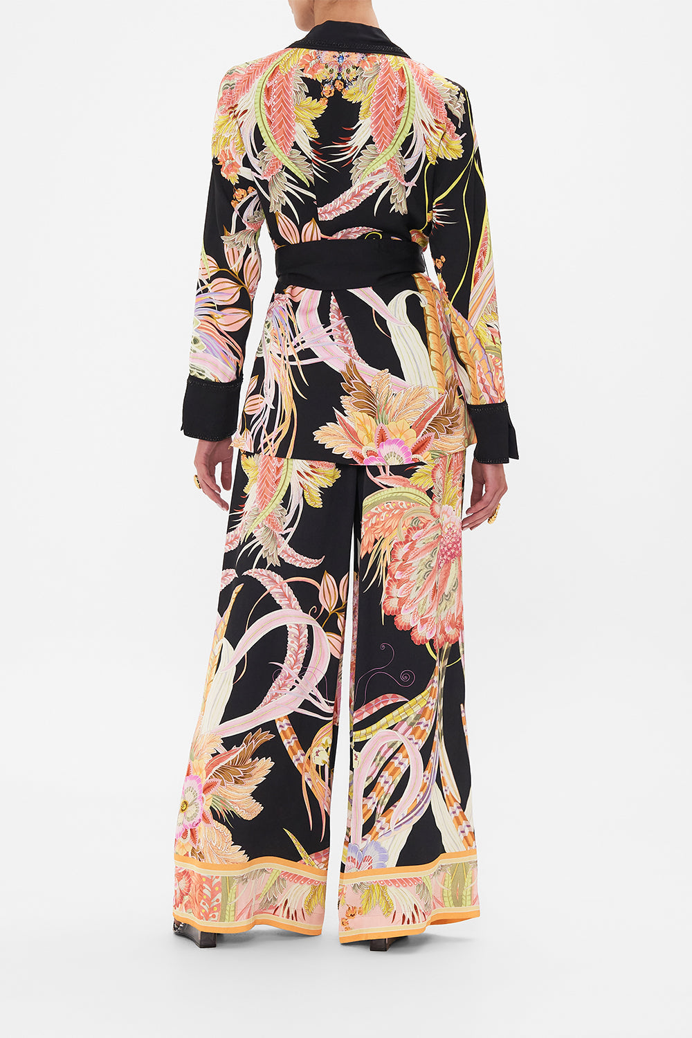 Back view of model wearing CAMILLA deisgner jacket in lady of The Moon Print