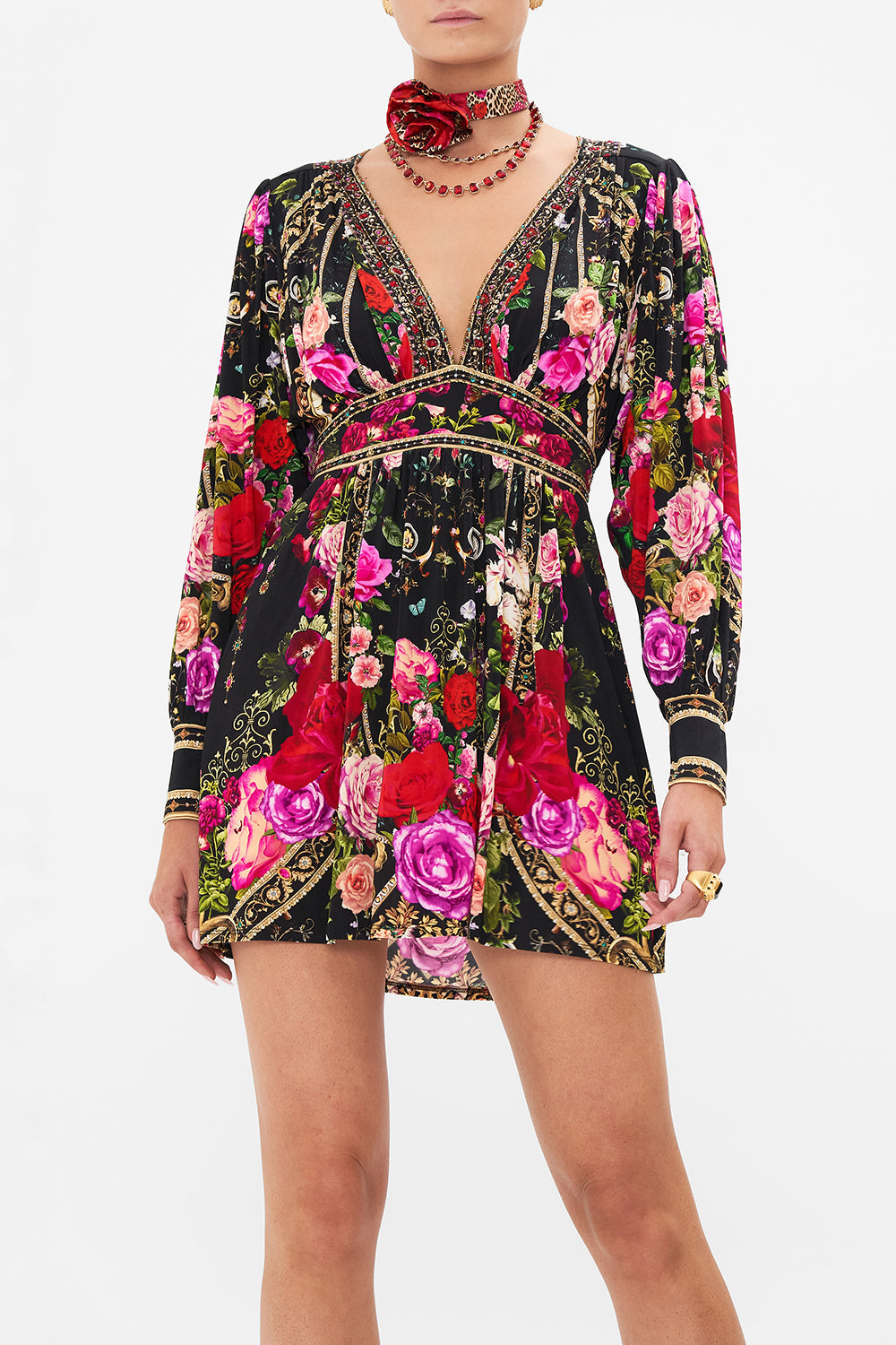 Crop view of model wearing CAMILLA jersey mini dress in Reservation For Love print