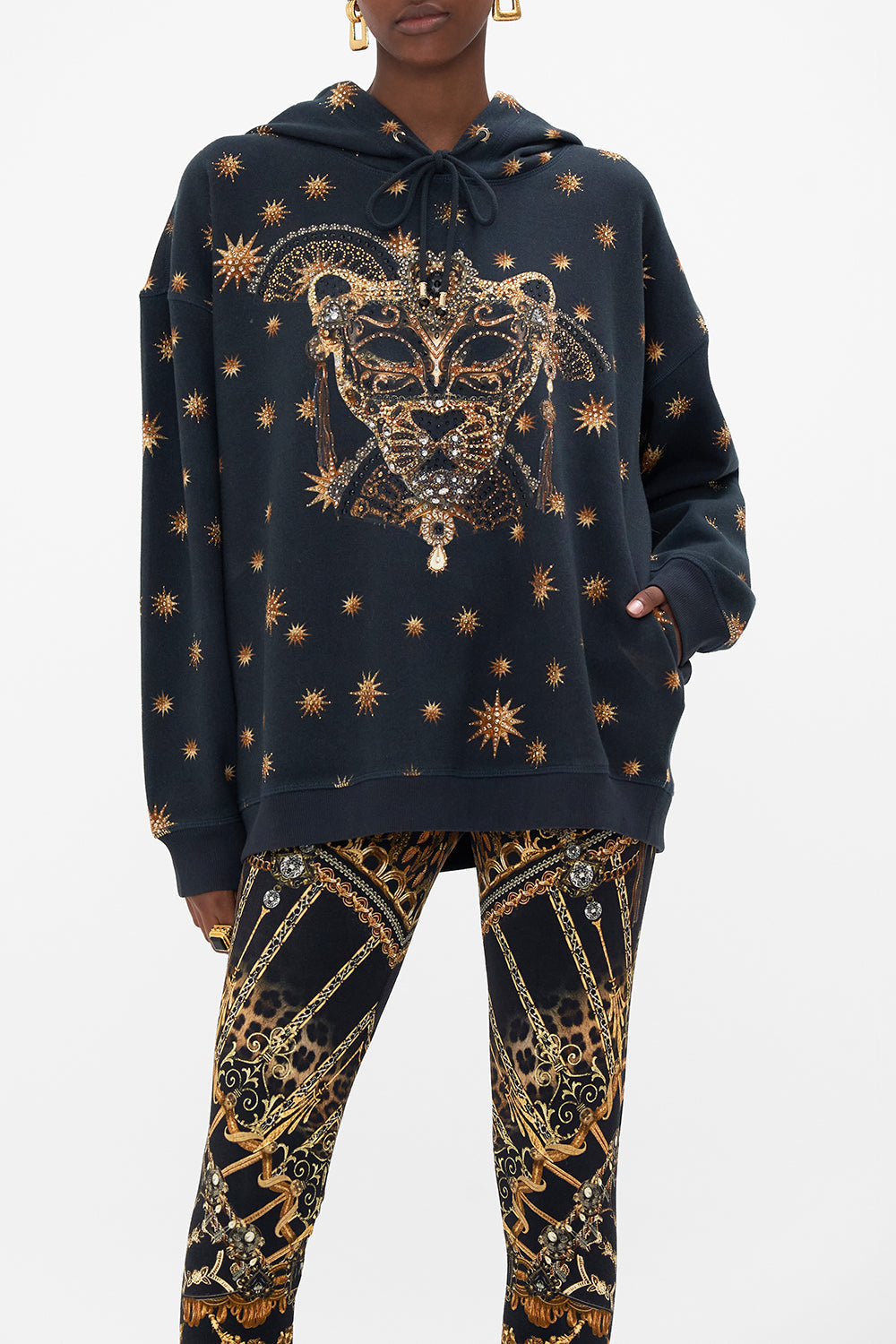 Crop view of model wearing CAMILLA luxury hoody in Masked At Moonlight print