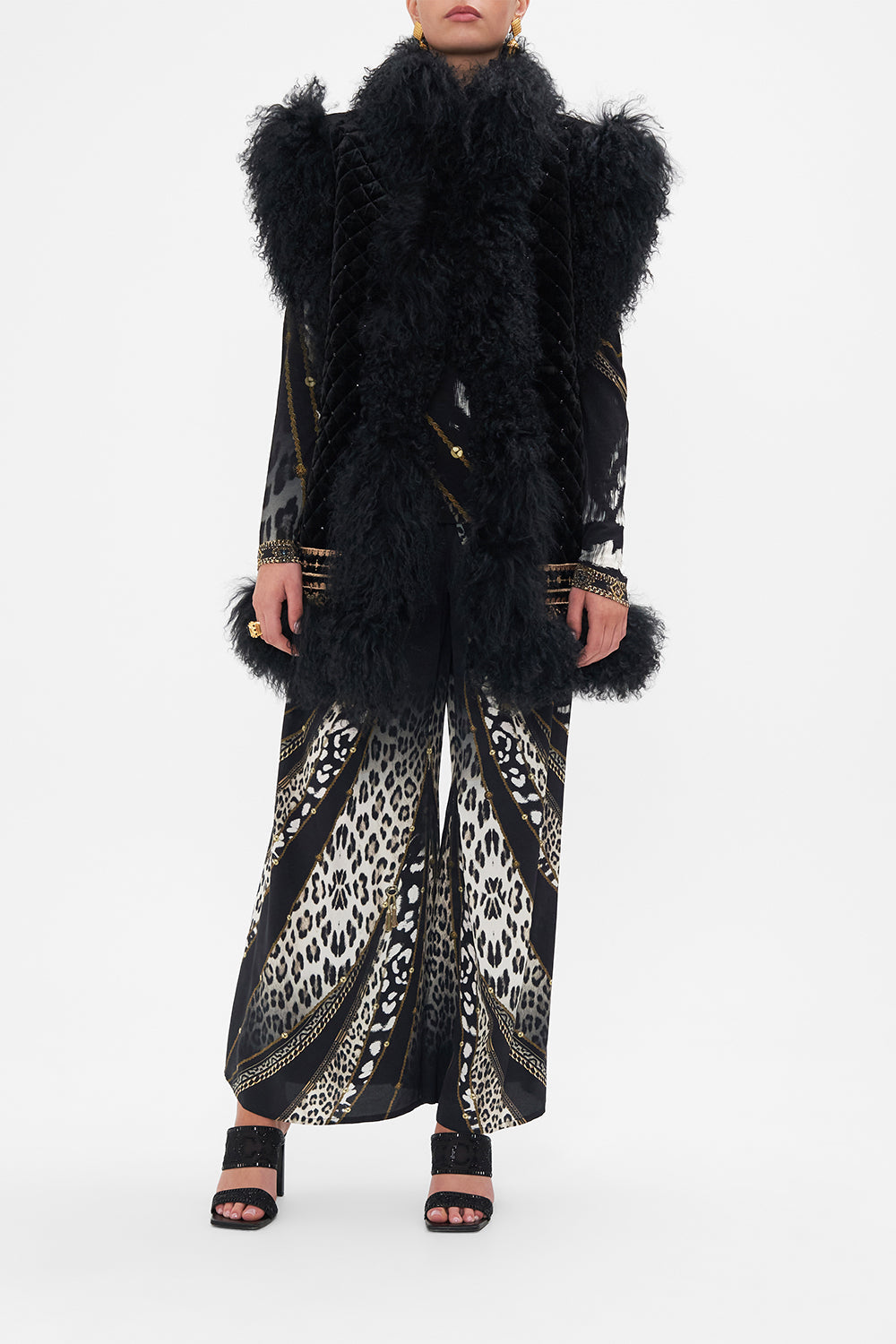 Front view of model wearing CAMILLA black fur vest in Untamed Royalty print