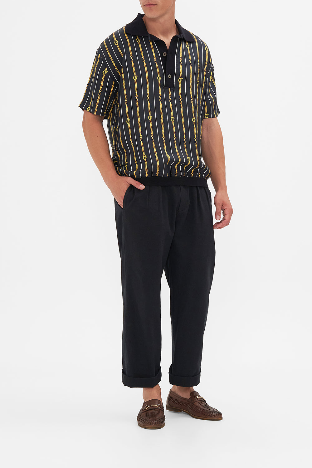 Front view of model wearing Hotel Franks by CAMILLA mens shirt sleeve polo shirt in Coast to Coast print