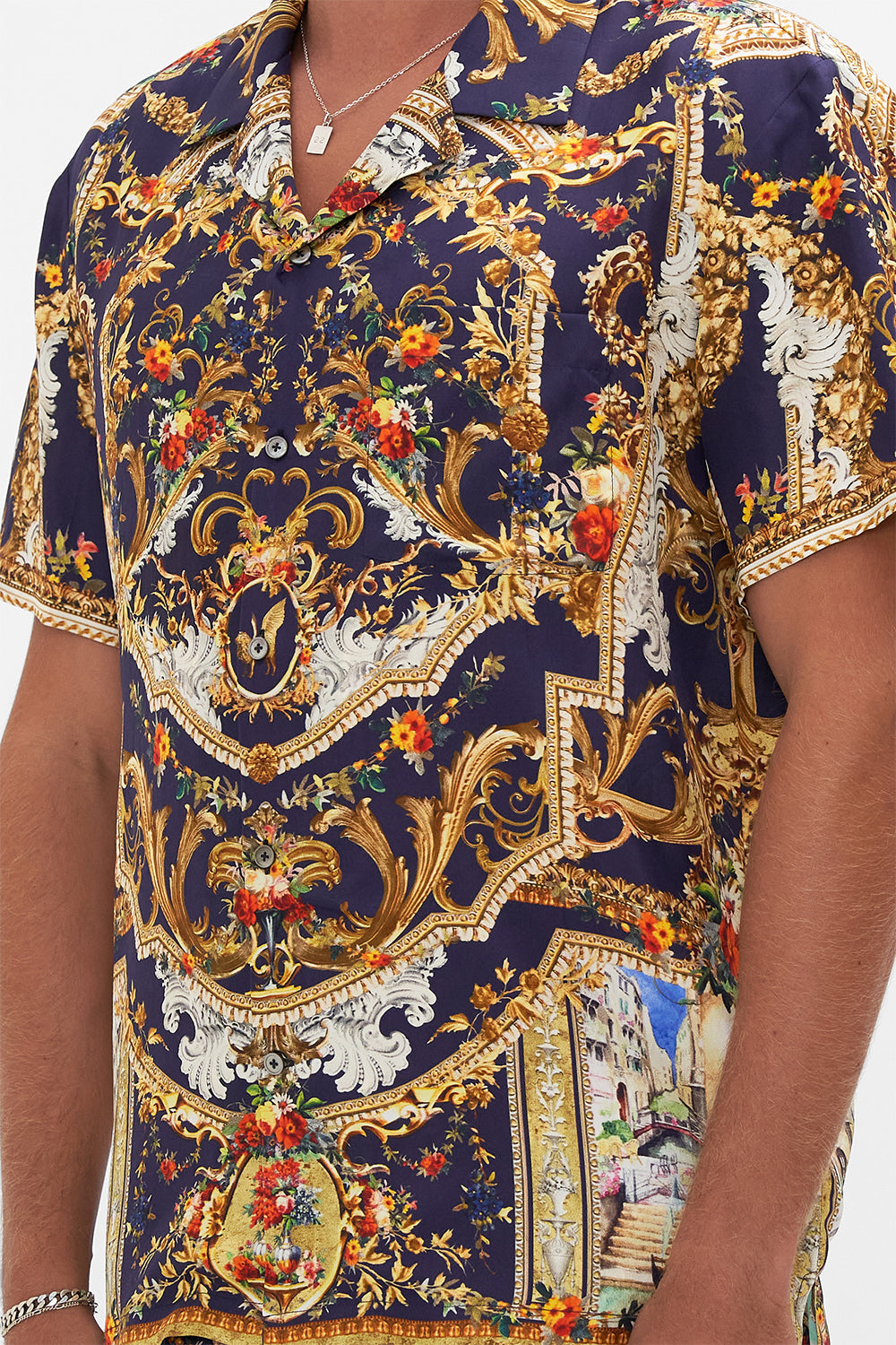 Detail view of model wearing Hotel Franks By CAMILLA mens short sleeve camp collared shirt in Venice Vignette print
