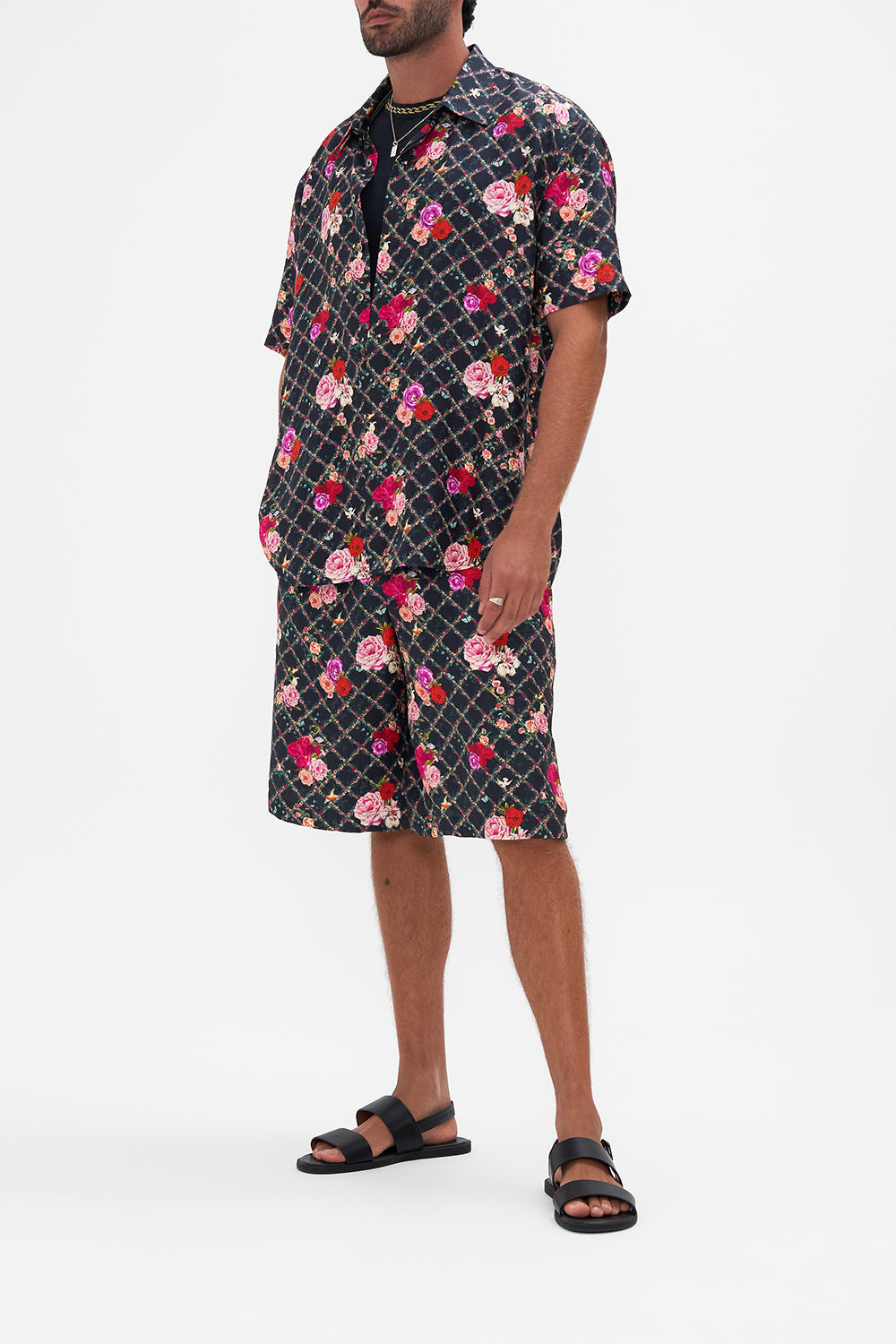 Side view of model wearing CAMILLA silk short sleeve shirt in Reservation For Love print