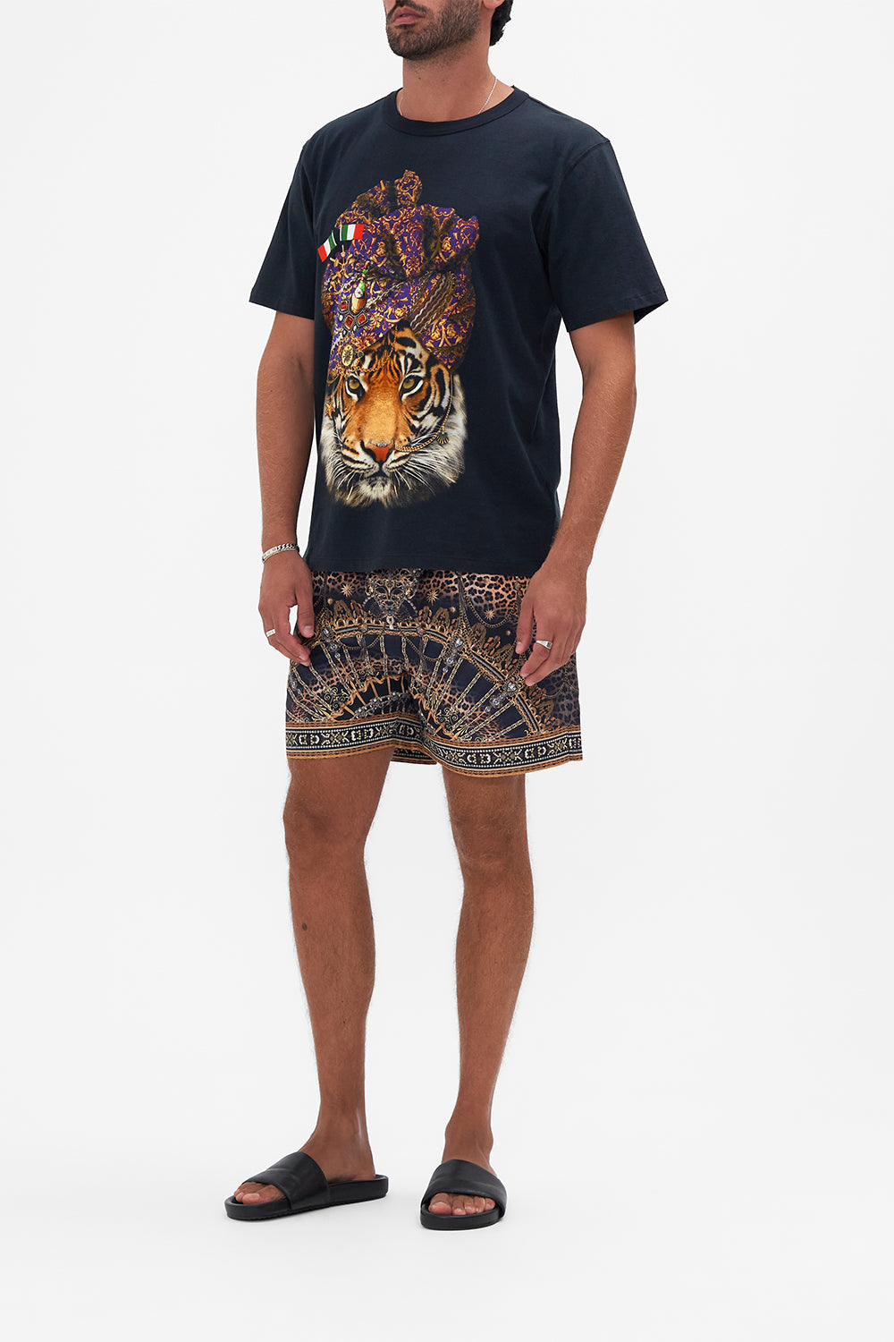 Side view of model wearing Hotel Franks By CAMILLA mens tee in Venice Vignette print