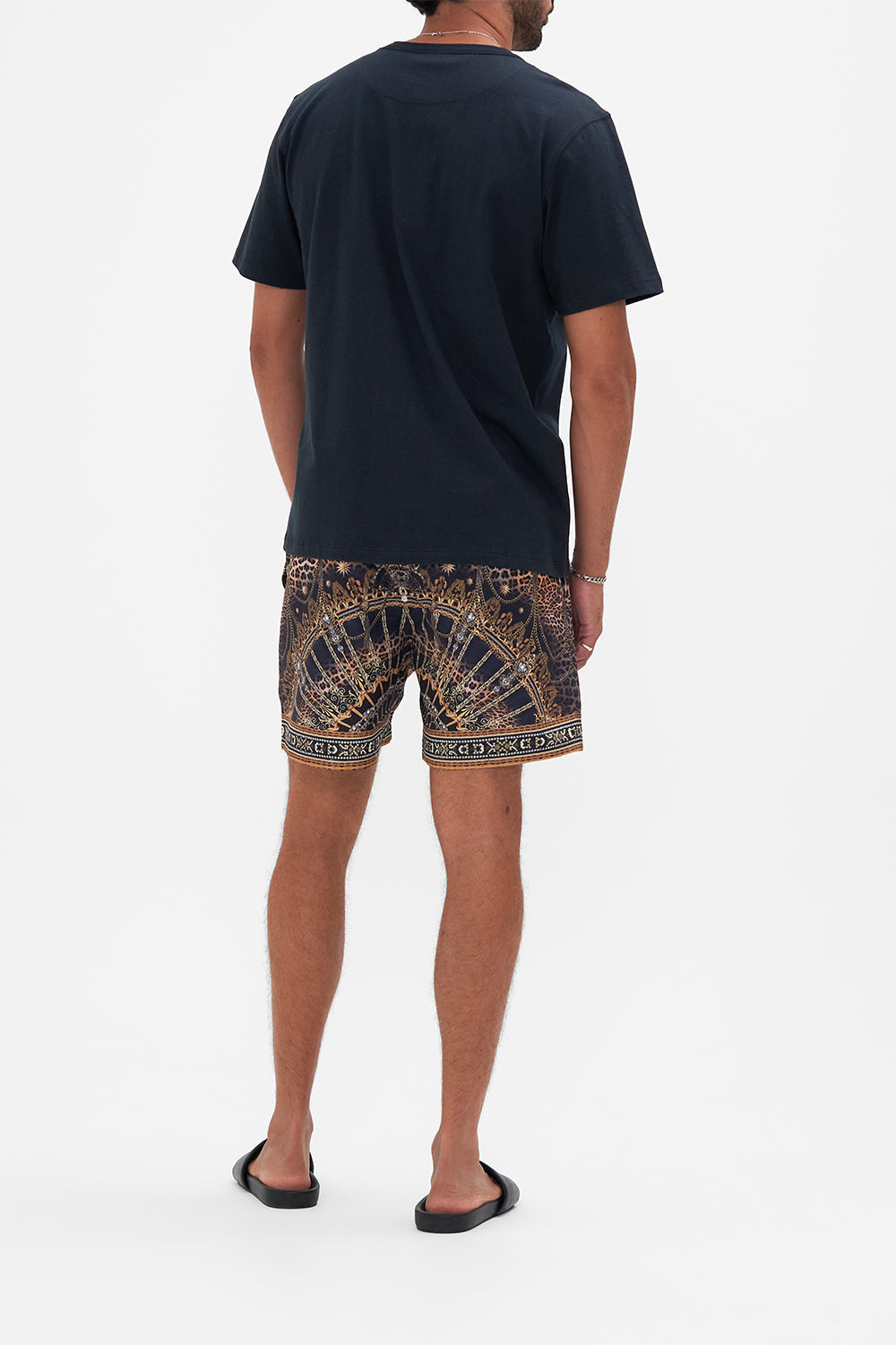 Back view of model wearing Hotel Franks By CAMILLA mens tee in Venice Vignette print