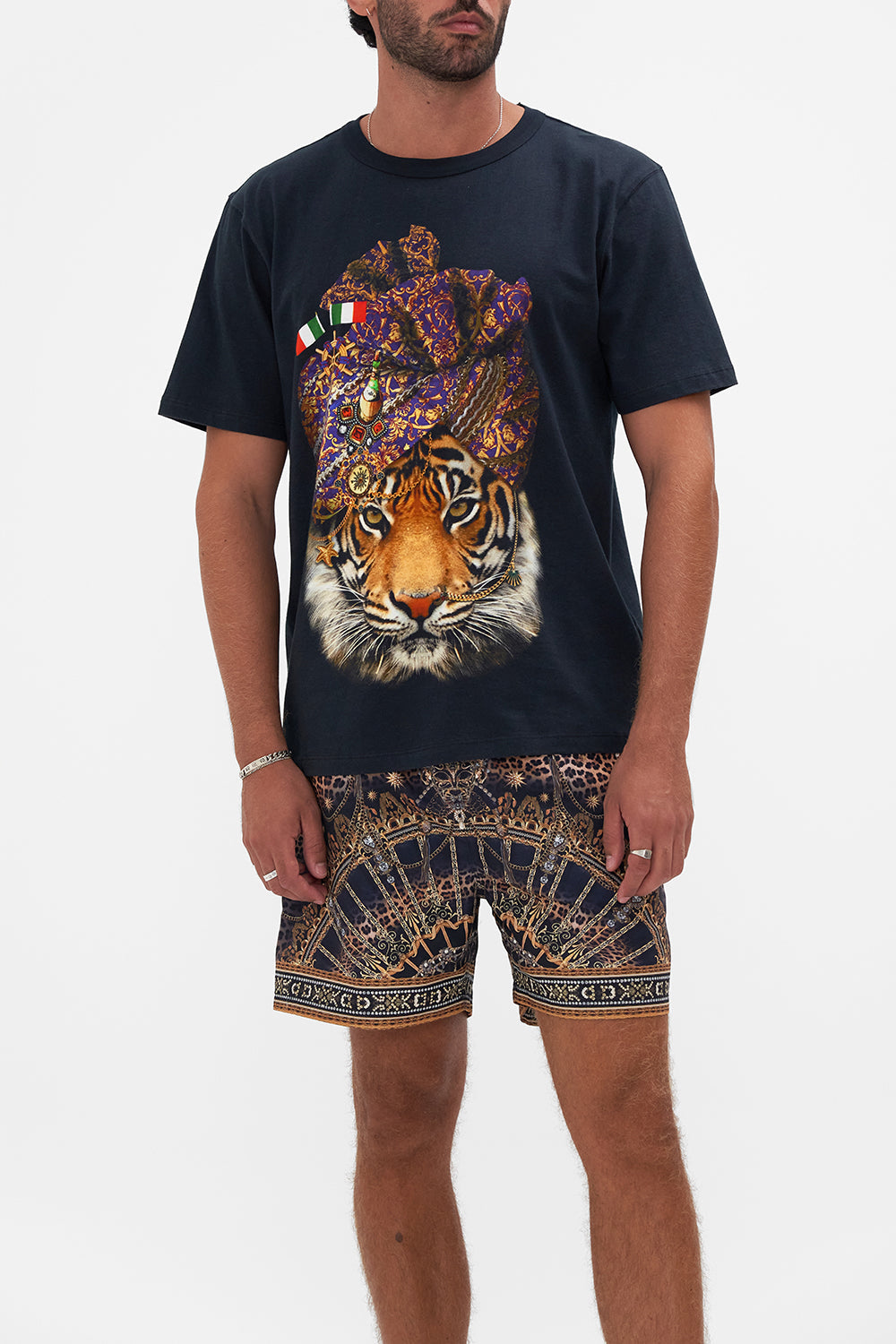 Crop view of model wearing Hotel Franks By CAMILLA mens tee in Venice Vignette print