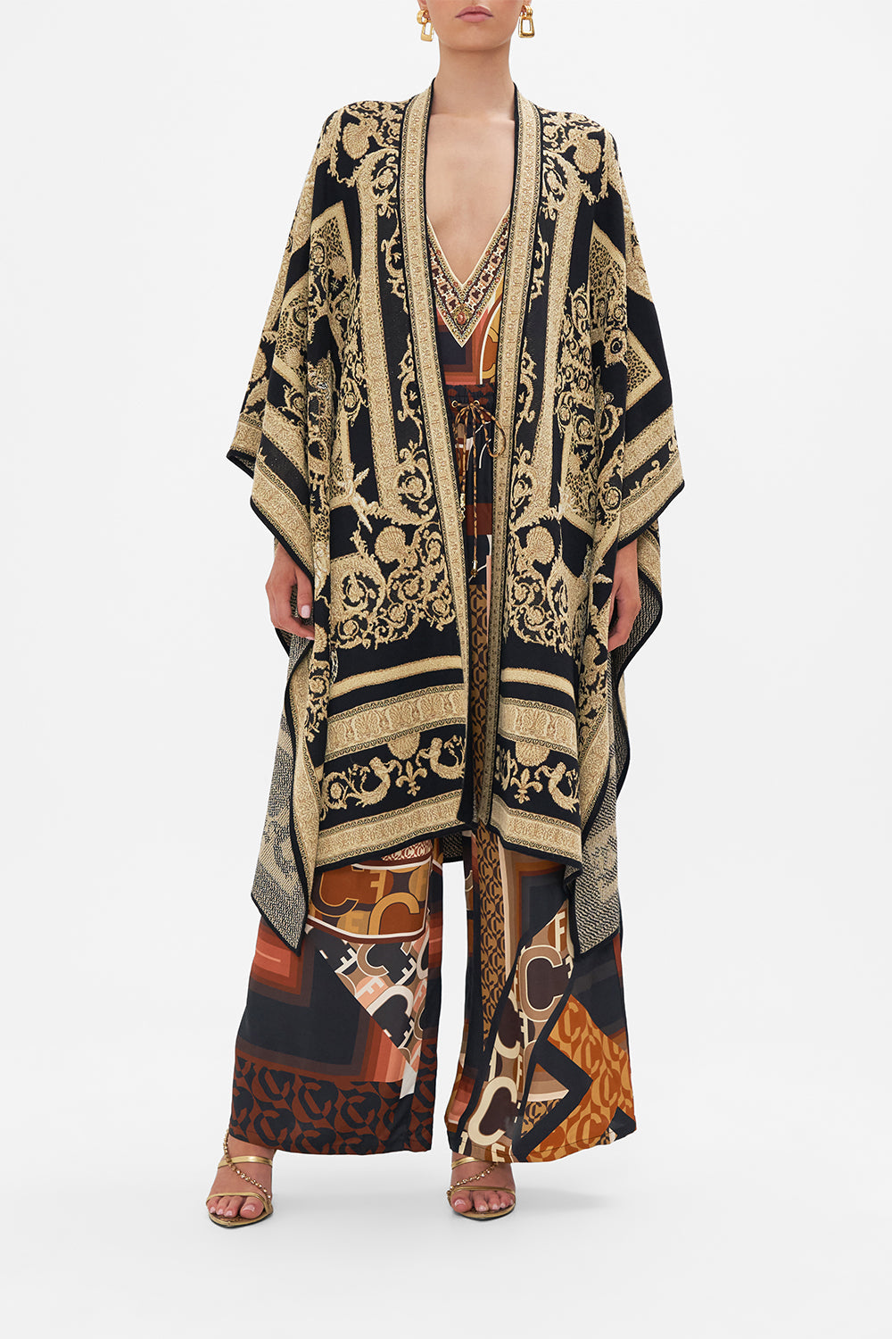 Front view of model wearing CAMILLA jacquard knit poncho in Feeling Fresco