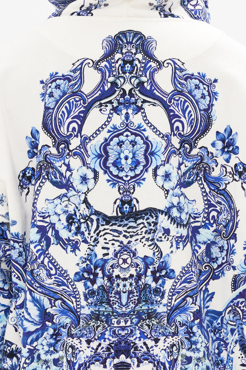 Detail view of model wearing Hotel Franks by CAMILLA mens oversized hoodie in Glaze and Graze print