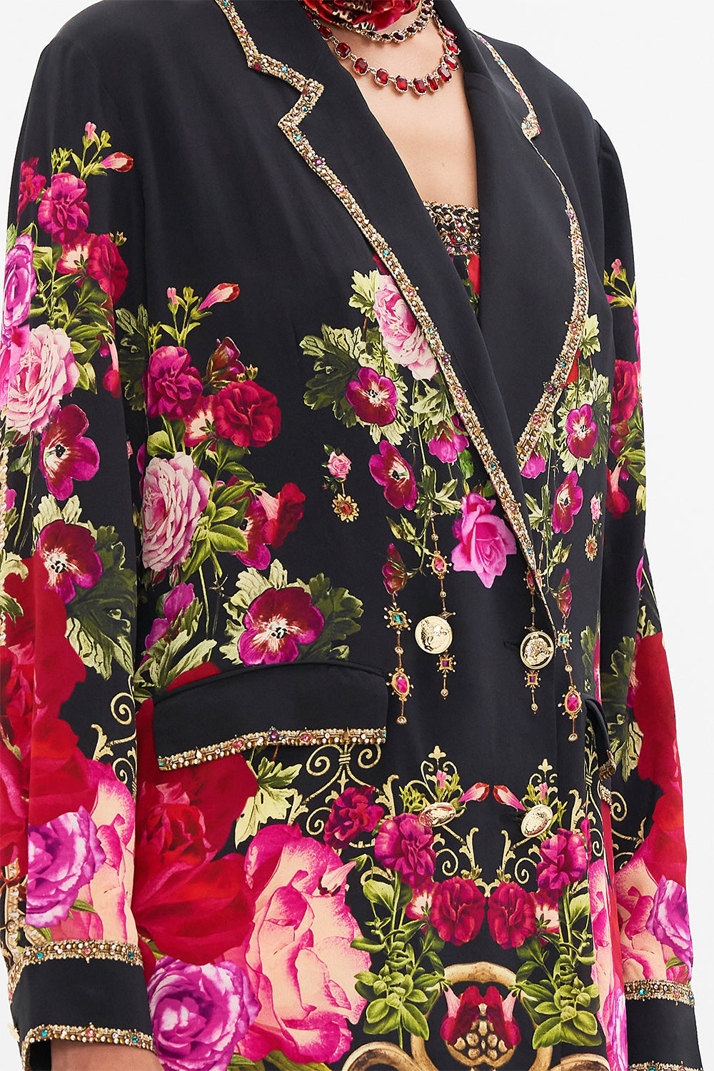 Detail view of model wearing CAMILLA silk jacket in Reservation For Love print