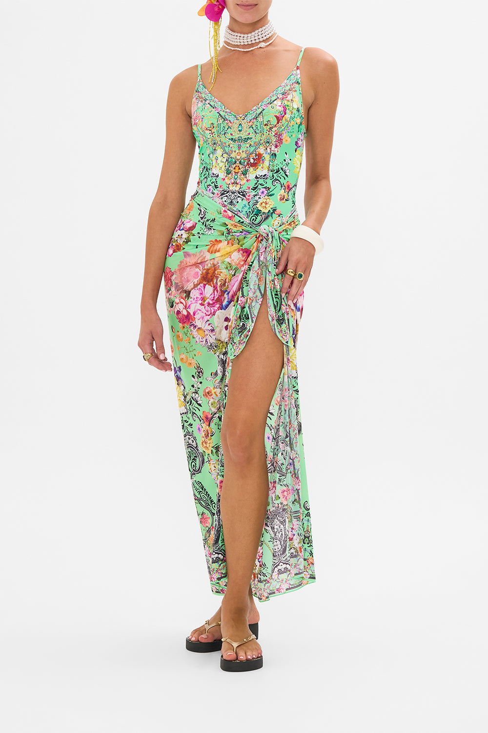 Detail view of model wearing CAMILLA resort wear one piece swimsuit in Porcelain Dream print