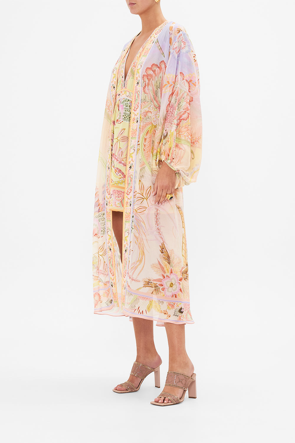 Side view of model wearing CAMILLA silk kimono in Cosmic Tuscna print