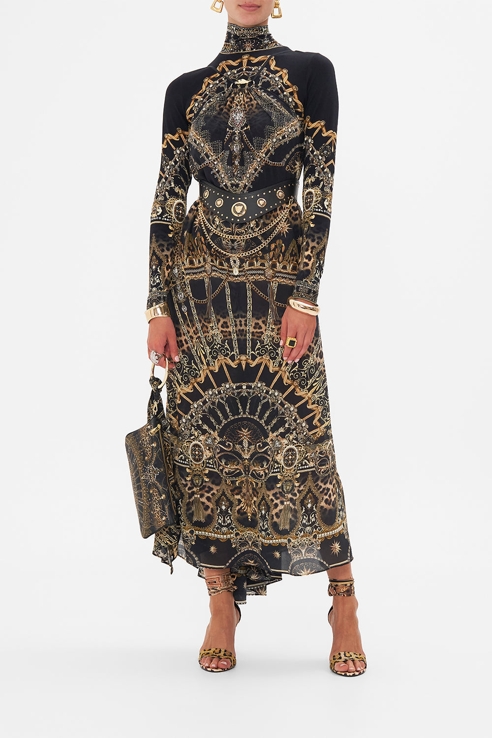 Detail view of model wearing CAMILLA designer halterneck maxi dress in masked At Moonlight print