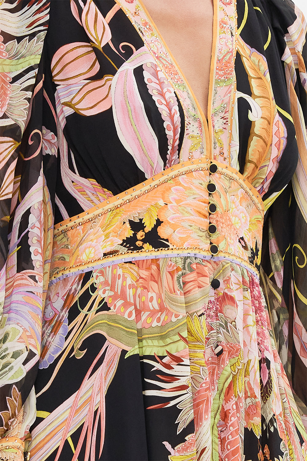 Detail view of model wearing CAMILLA designer silk dress in Lady Of The Moon print