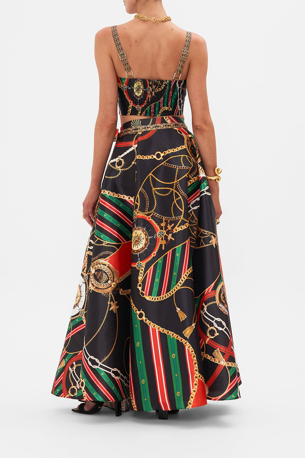 Back view of model wearing CAMILLA designer flared pants in Soul of A Stargazer print