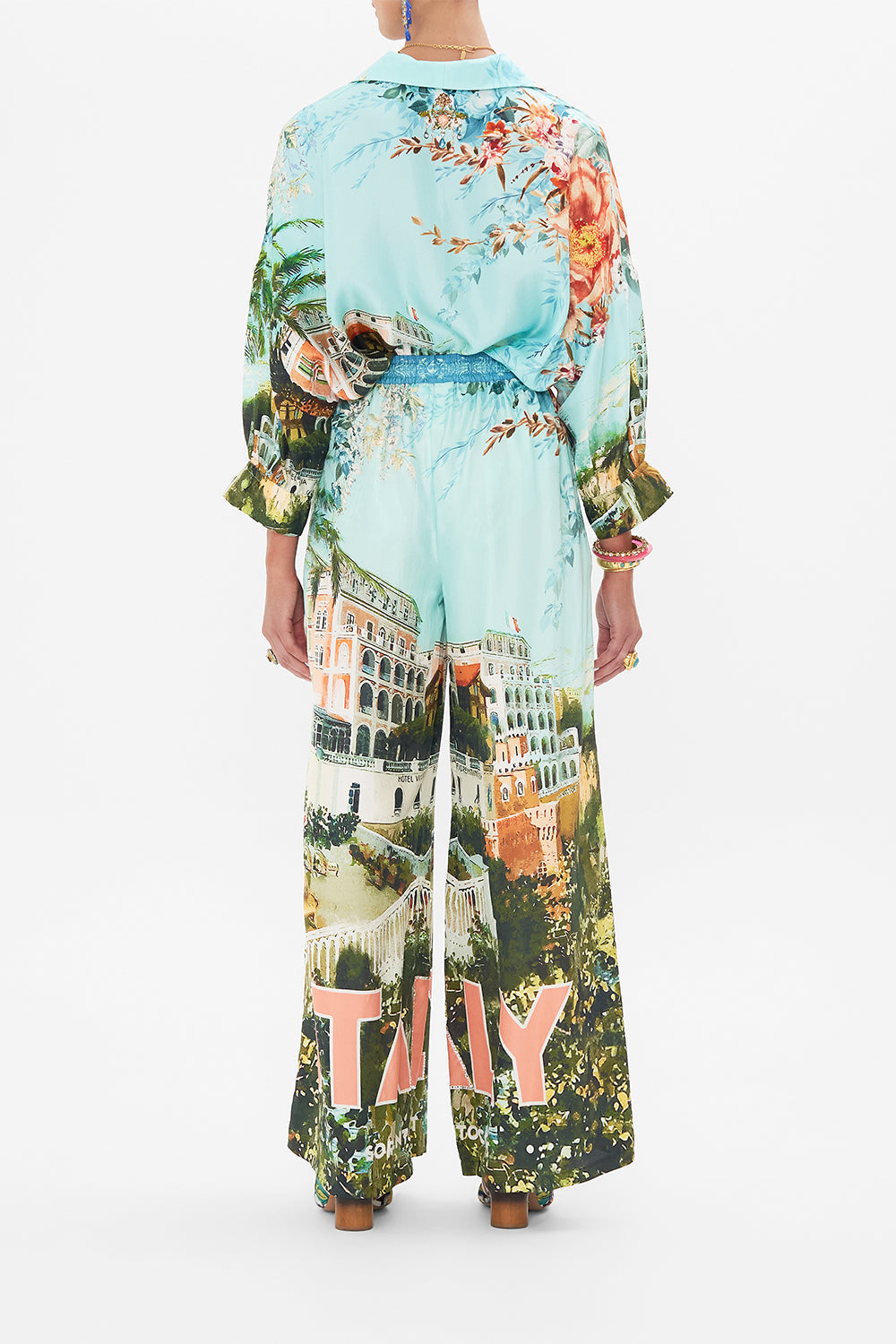 Back view of model wearing CAMILLA silklounge pant in From Sorrento With Love print