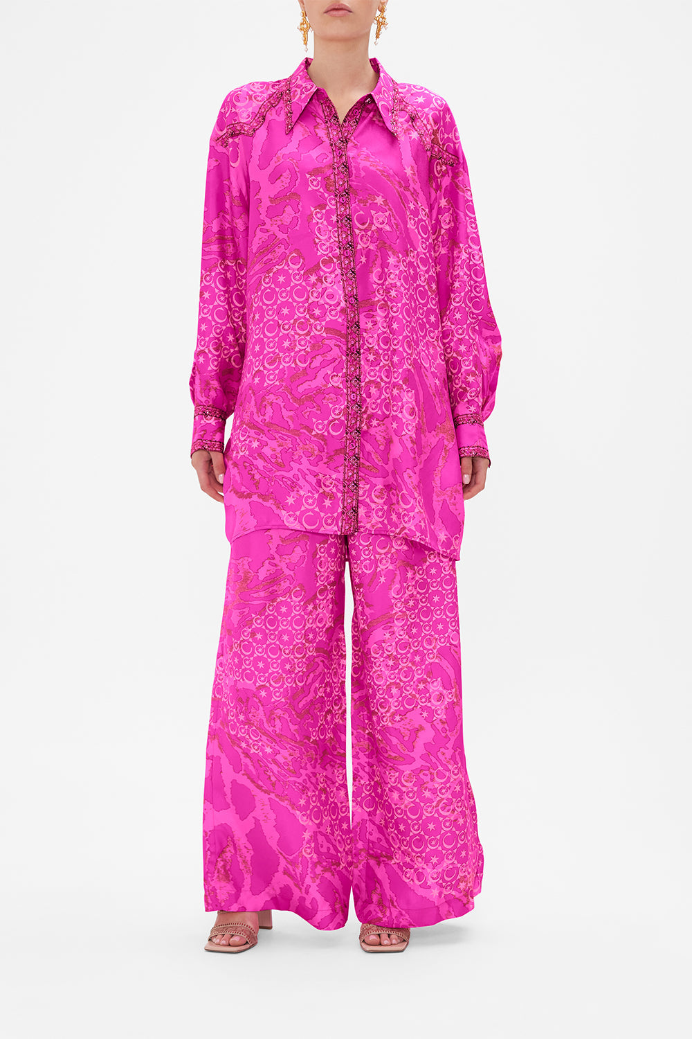 Front view of model wearing CAMILLA silk shirt in neon Song Of Sacrifice print