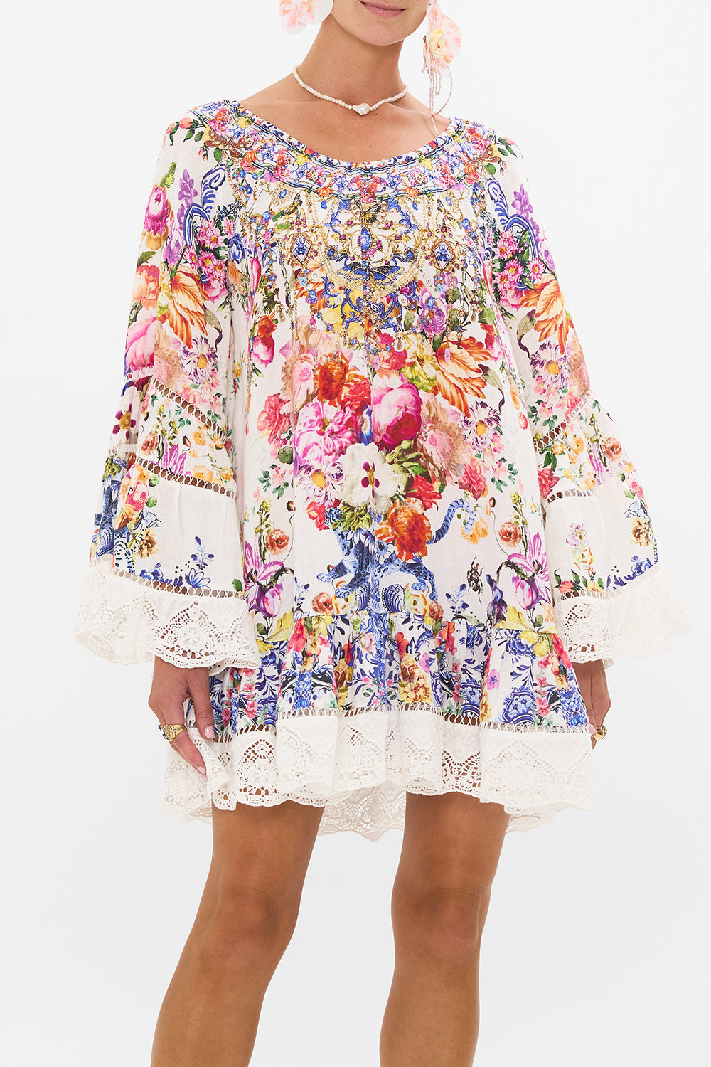 Crop view of model wearing CAMILLA frill dress in Dutch Is Life print