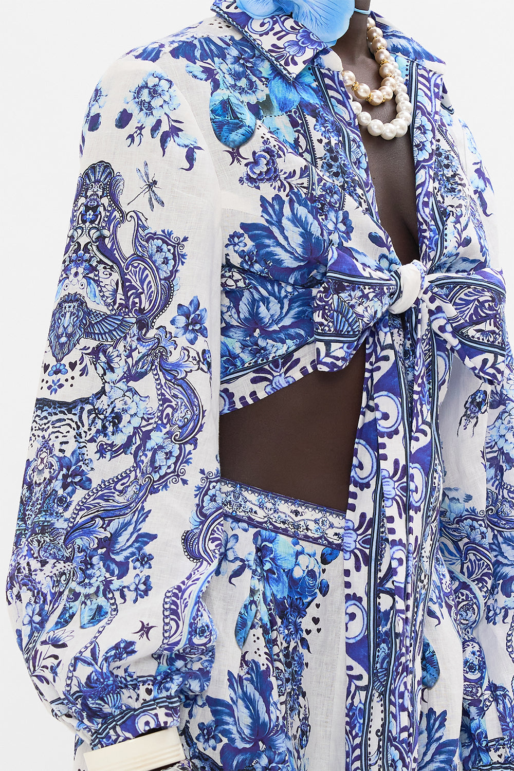 Detail view of model wearing CAMILLA cropped wrap shirt in Glaze and Graze print