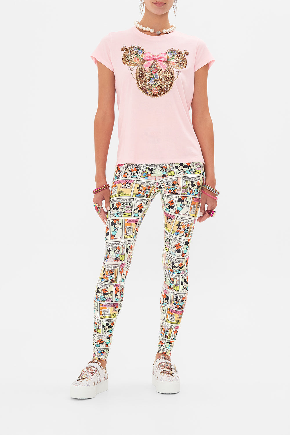 Front view of model wearing Disney x CAMILLA pink t shirt in Minnie Mouse Magic print