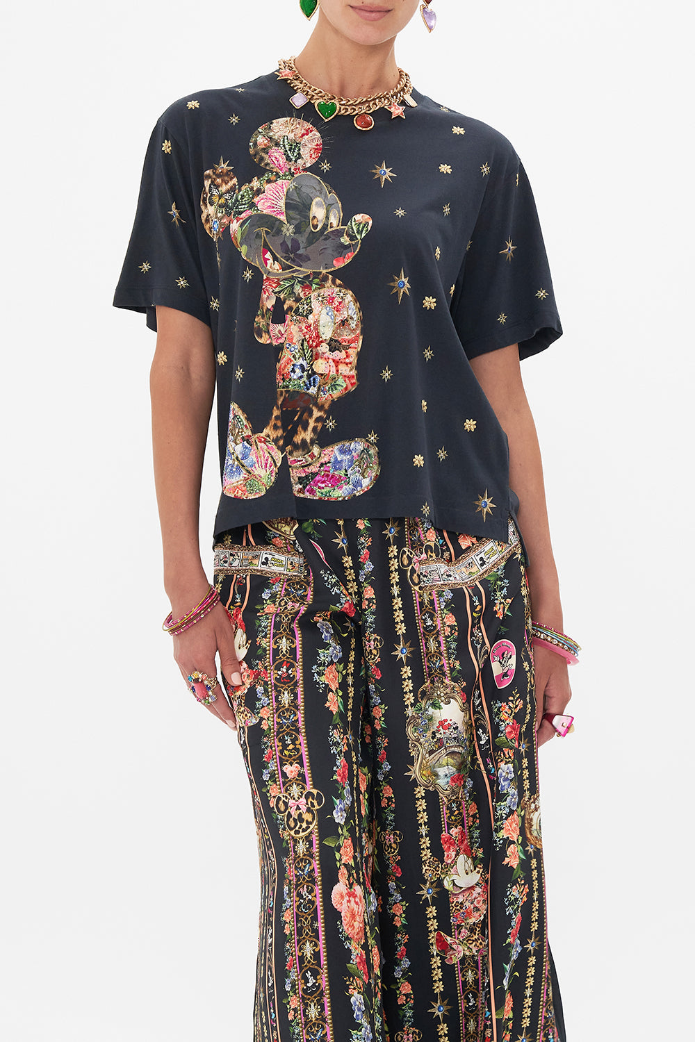 Crop view of model wearing Disney x CAMILLA womens black t shirt in Midnight At Minnies