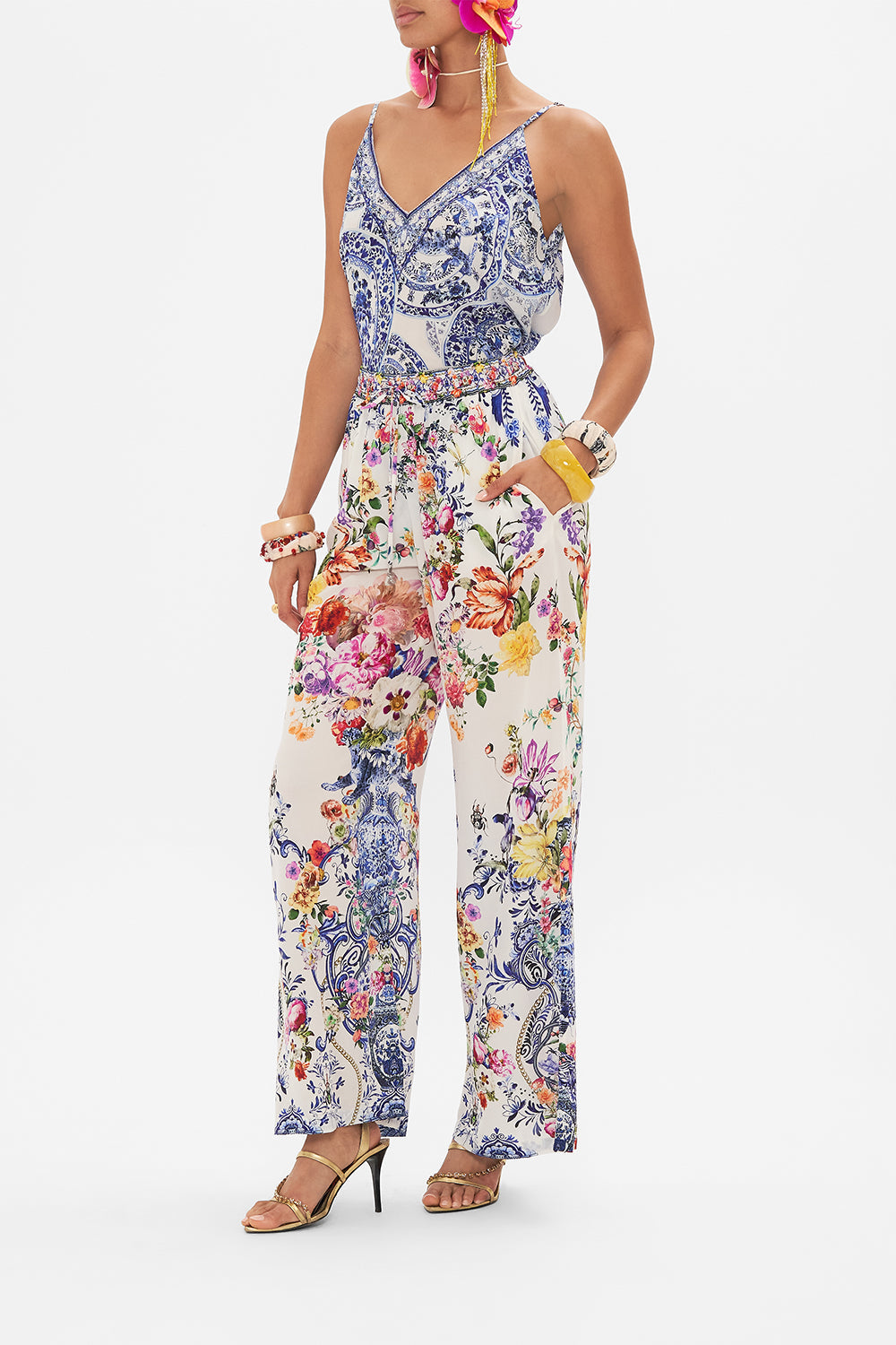 Side view of model wearing CAMILLA silk pants in Dutch Is Life print