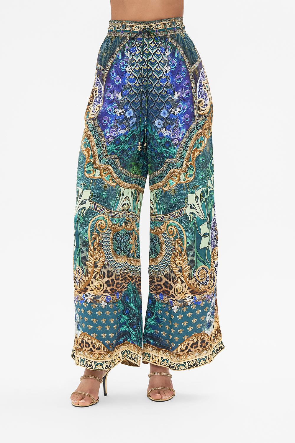 Crop view of model wearing CAMILLA silk pants in Fan Dance print