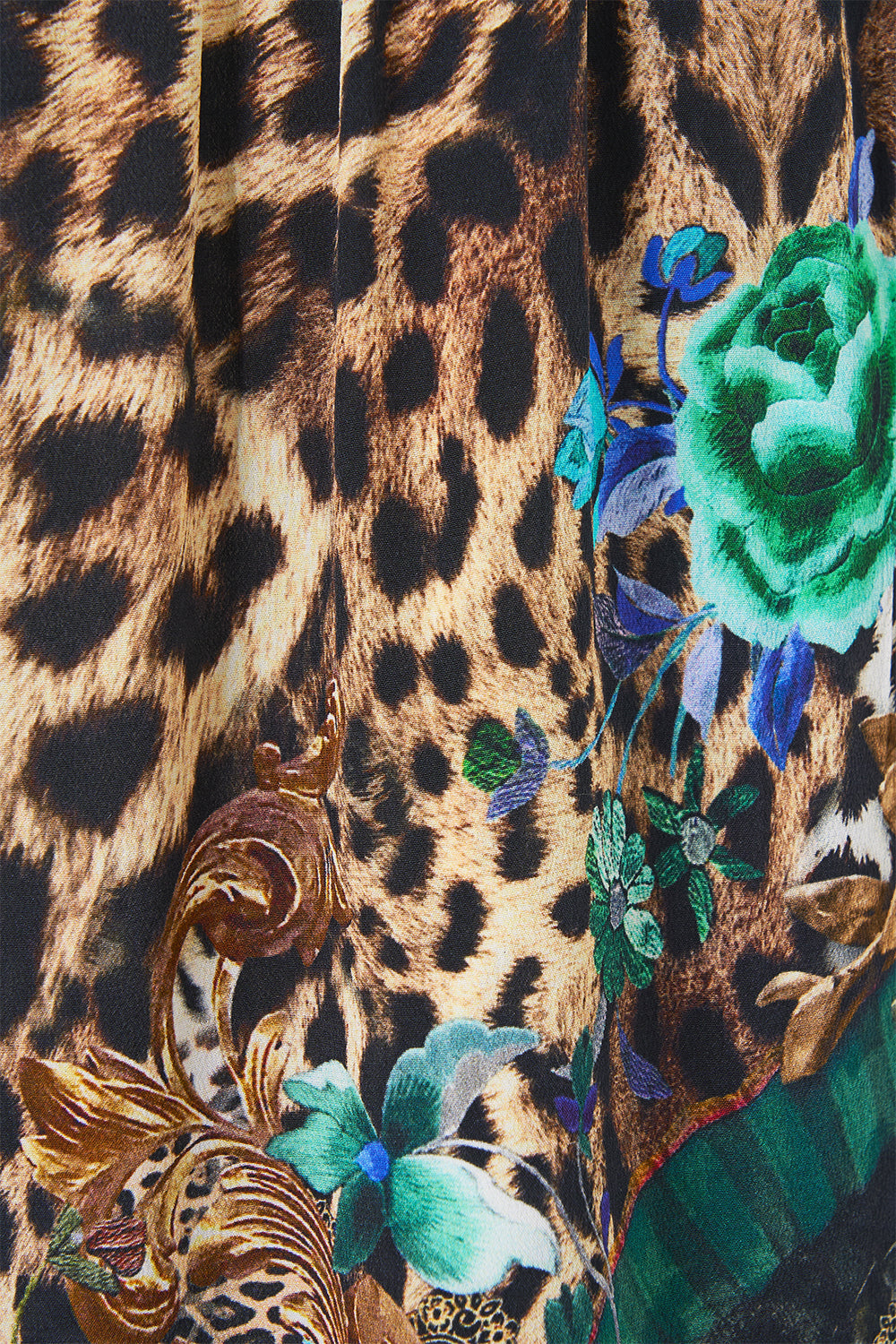 The CAMILLA MID LENGTH BOARDSHORT WITH ELASTIC WAIST CLOAKED IN BAROQUE in our print.