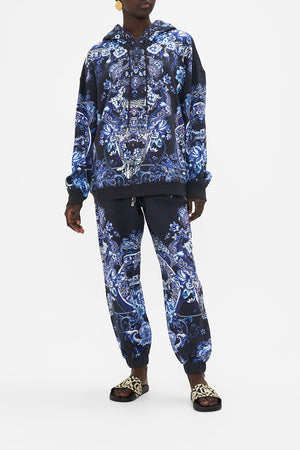 Front view of model wearing CAMILLA printed hoodie in Delft Dynasty print