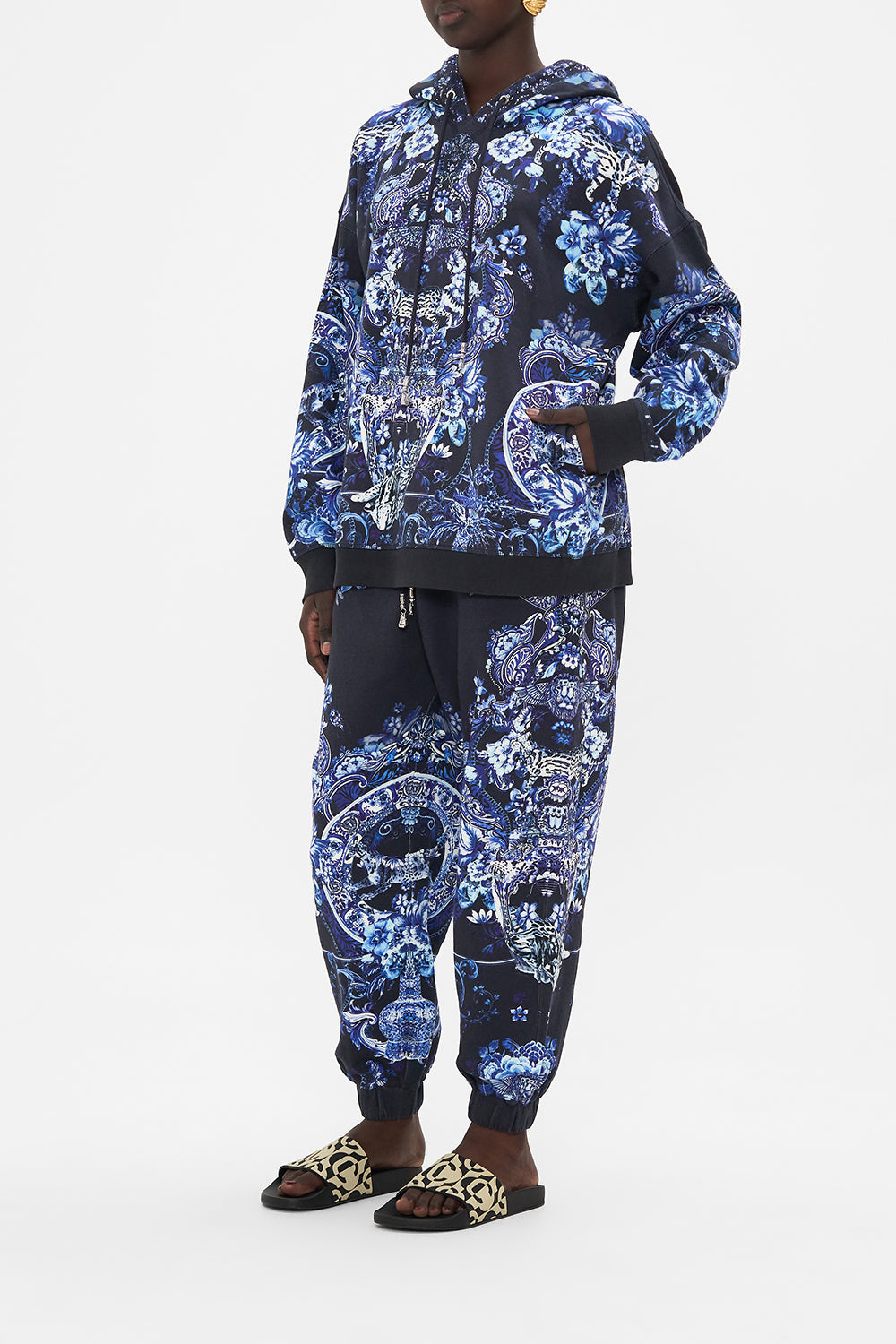 Side view of model wearing CAMILLA printed hoodie in Delft Dynasty print
