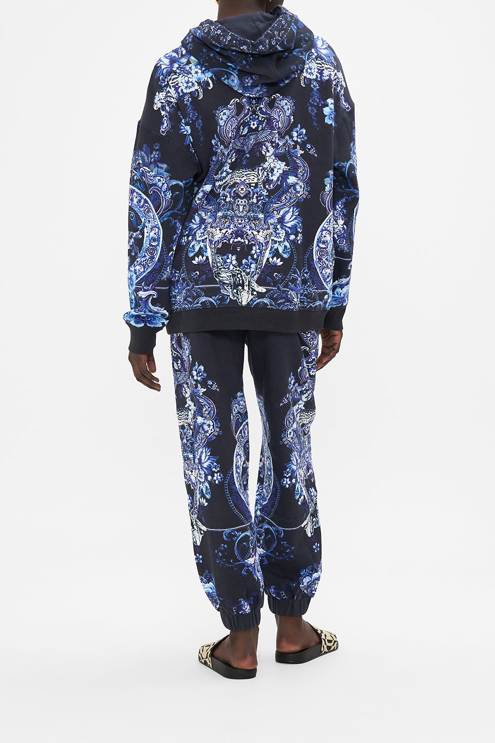 Back view of model wearing CAMILLA printed hoodie in Delft Dynasty print