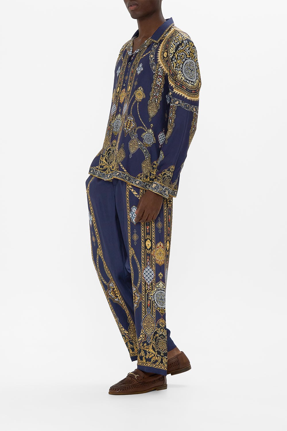 The CAMILLA BUTTON UP TOP WITH DRAPED BACK COSMIC ZOOLOGY in our  print.