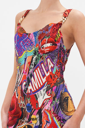 Detail view of model wearing CAMILLA bias silk slip dress in multicoloured Radical Rebirth print