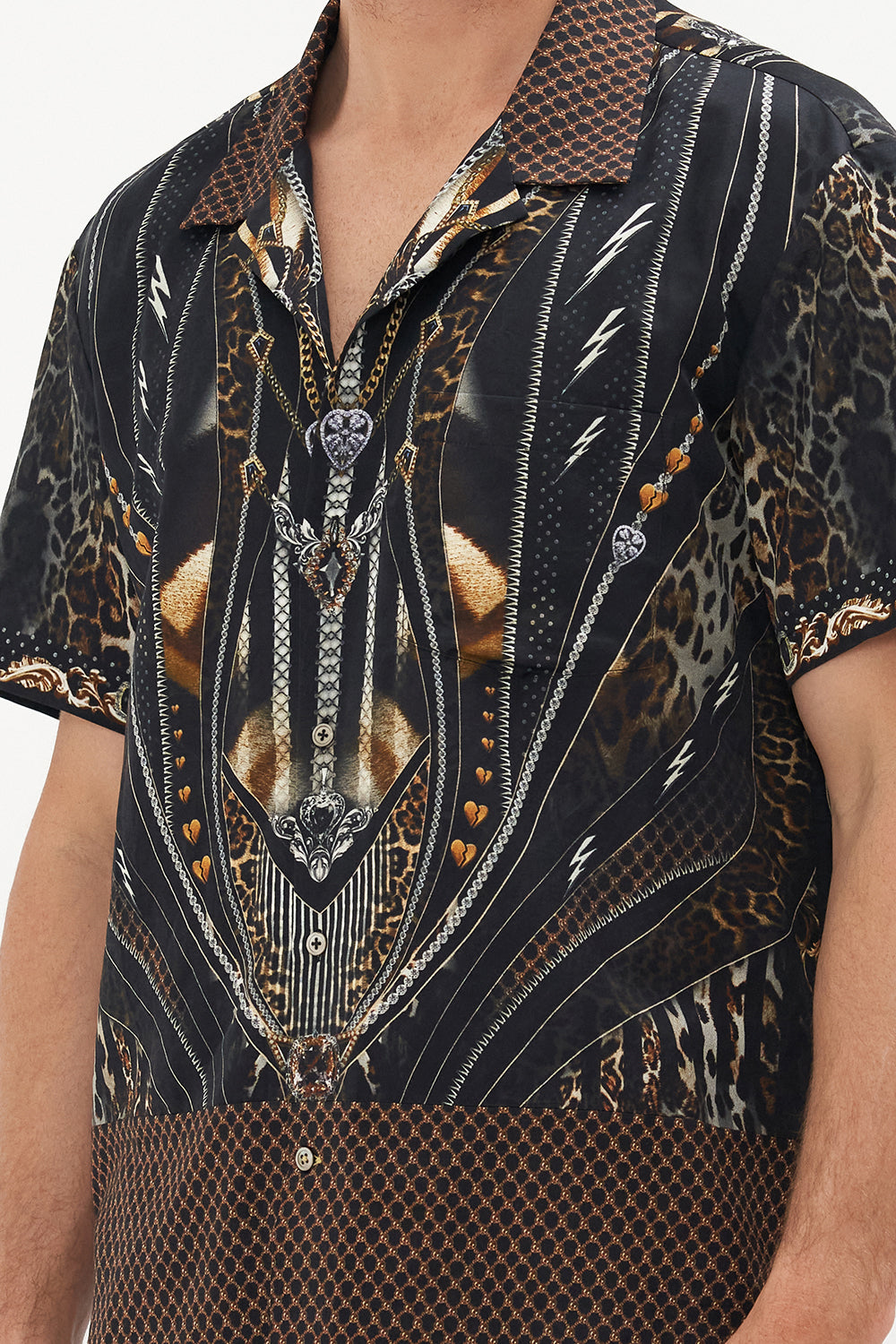 Detail view of model wearing Hotel Franks by CAMILLA mens short sleeve camp collar shirt in Chaos in The Cosmos animal print 