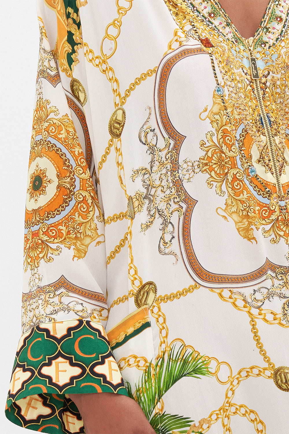 Detail view of model wearing CAMILLA white silk kaftan My Sweet Devotion print